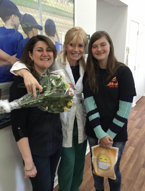 Dr. Danoff standing with a mom and her daughter