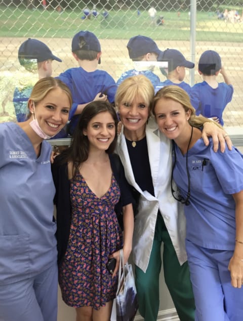 Dr. Danoff, Dr. Danoff Rudick, and Dr. Danoff Geft standing with female patient