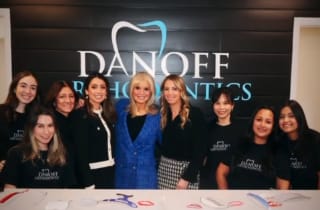 Group of people at a ribbon cutting