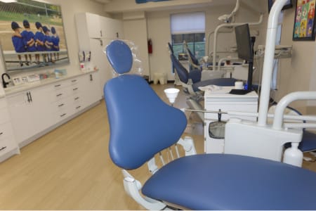 Interior of waiting room looking at the reception area with tv above the window